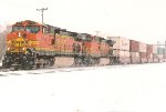 Westbound stacker dashes through the snow